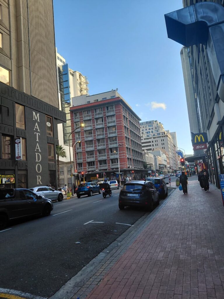 The long street in Cape Town featuring different eateries.